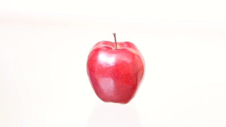 A red apple photographed on white for the question what is aphantasia; the photograph is a prompt, not a depiction of someone’s inner experience.