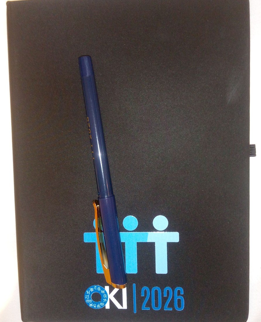 A notebook and pen photographed in 2026, illustrating an external reminder rather than an intervention tested in doorway-effect experiments.