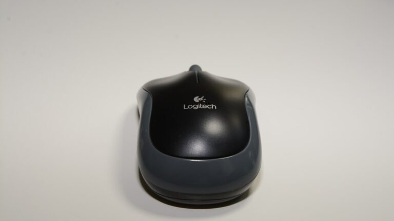 Logitech M185 mouse photographed on a white background, illustrating the mouse utility changes in PowerToys 0.102.